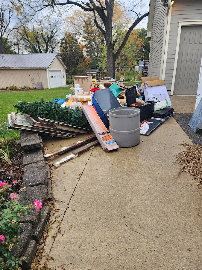 Dumpster being loaded with debris for 3 Yard Dumpster Rental in North Bay Village